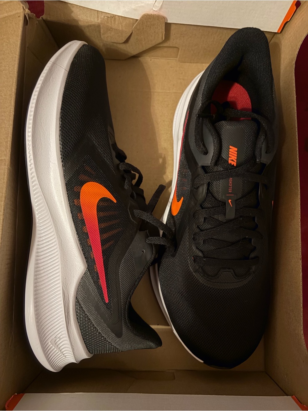 Nike Men's Black Athletic Shoes with Orange/Red Swoosh